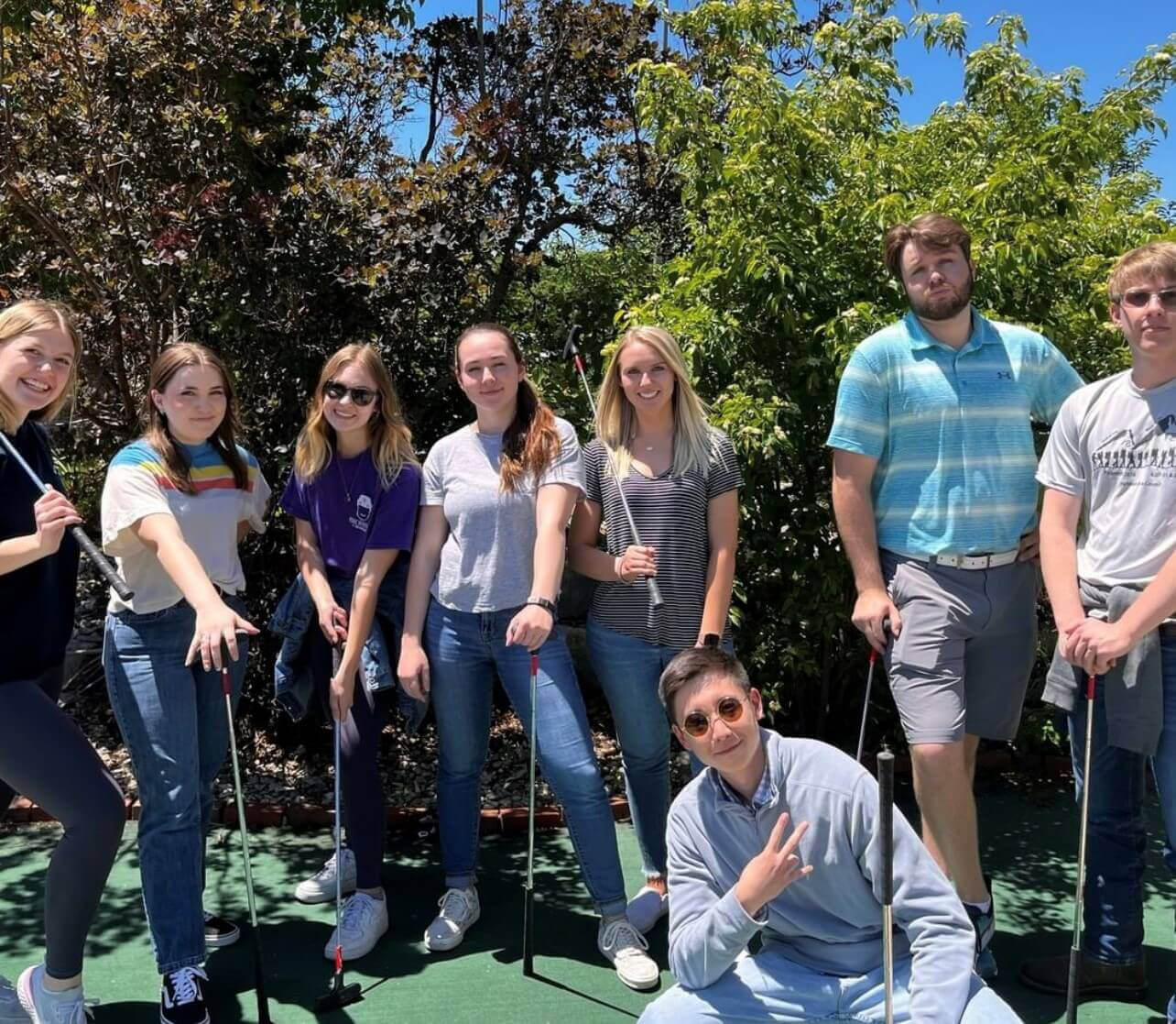 Interns playing miniature golf